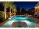 Beautifully designed pool area with water features, tanning ledges, and mature palm trees create an outdoor oasis at 171 Cartright St, Charleston, SC 29492