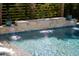 Backyard pool with a waterfall feature and lush landscaping for a tranquil and inviting atmosphere at 171 Cartright St, Charleston, SC 29492