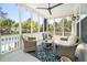 Comfortable screened porch with wicker seating and ceiling fan overlooking the backyard at 171 Cartright St, Charleston, SC 29492