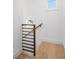 Bright foyer staircase with modern wood railings and light hardwood floors at 171 Cartright St, Charleston, SC 29492