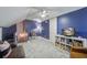 Attic bonus room with blue painted walls, sitting area, and a modern ceiling fan at 1728 Barracuda Rd, Johns Island, SC 29455