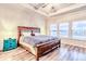 Spacious main bedroom with natural light, ceiling fan, and a blue dresser at 187 Red Blf St, Summerville, SC 29483