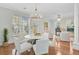 Elegant dining room with modern furnishings and ample natural light, perfect for gatherings at 1896 Palmetto Isle Dr, Mount Pleasant, SC 29466