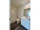 Well-lit bathroom features modern vanity, sleek fixtures, and a shower-tub combination at 1903 Scarlett Maple St, Summerville, SC 29486