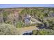 An aerial view showcasing the house nestled amidst lush trees, highlighting the serene and private setting at 1926 Grimball Rd, Charleston, SC 29412