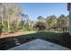 A serene backyard with a well-maintained lawn and a fenced perimeter offers privacy and relaxation at 1926 Grimball Rd, Charleston, SC 29412