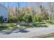 A spacious backyard features raised garden beds and lush greenery, perfect for outdoor enjoyment at 1926 Grimball Rd, Charleston, SC 29412