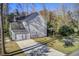 Backyard featuring a two-car garage, green space, and raised garden beds at 1926 Grimball Rd, Charleston, SC 29412