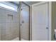 Tiled bathroom with glass shower door and shower head at 1926 Grimball Rd, Charleston, SC 29412