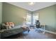 Inviting bedroom with comfortable bed, soft lighting, desk and chair, and lots of natural light from a double window at 1926 Grimball Rd, Charleston, SC 29412