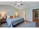 Serene bedroom featuring a comfortable bed, ceiling fan, and plenty of natural light streaming through a large window at 1926 Grimball Rd, Charleston, SC 29412