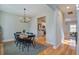 Dining area featuring a wood table, black chairs, rug, and hardwood floors at 1926 Grimball Rd, Charleston, SC 29412