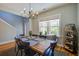 Bright dining room featuring a modern chandelier and a large window at 1926 Grimball Rd, Charleston, SC 29412