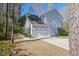 View of home with a two car garage and a well-manicured yard, ideal for outdoor activities at 1926 Grimball Rd, Charleston, SC 29412