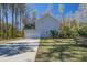 View of home with a two car garage and a well-manicured yard, ideal for outdoor activities at 1926 Grimball Rd, Charleston, SC 29412