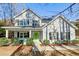 Charming two-story home featuring a welcoming front porch and bright green door at 1926 Grimball Rd, Charleston, SC 29412