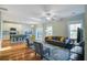 Open-concept living area with hardwood floors, modern furniture, and natural light at 1926 Grimball Rd, Charleston, SC 29412
