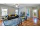 Living room with hardwood floors, a ceiling fan, and comfortable seating at 1926 Grimball Rd, Charleston, SC 29412