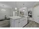 Modern kitchen with an island, stainless steel appliances, recessed lighting and a view into an adjacent living space at 200 Bucksley Ln # 308, Charleston, SC 29492