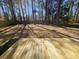 A newly built wood deck offers backyard views at 212 Regent St, Summerville, SC 29483