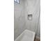Bathroom featuring tub with tile surround and niche at 212 Regent St, Summerville, SC 29483
