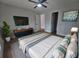 Comfortable bedroom featuring stylish decor, hardwood floors and a ceiling fan at 212 Regent St, Summerville, SC 29483