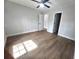 Bright bedroom with a ceiling fan, hardwood floors and freshly painted walls at 212 Regent St, Summerville, SC 29483
