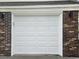 Brick home exterior with a white garage door at 212 Regent St, Summerville, SC 29483