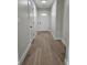 Inviting hallway featuring hardwood floors, neutral paint and white doors at 212 Regent St, Summerville, SC 29483
