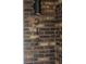 Close-up of the house number '212' affixed to the brick exterior wall at 212 Regent St, Summerville, SC 29483