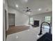 Open concept living room with modern fan and fireplace at 212 Regent St, Summerville, SC 29483