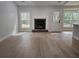 Bright living room with fireplace, neutral paint, hardwood floors, and natural light at 212 Regent St, Summerville, SC 29483