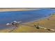 Stunning aerial view of private dock with gazebo, pier, boat, kayak access, and coastal waterway at 2415 Jasper Patterson Dr, Johns Island, SC 29455