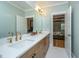 This bathroom features double sinks and a white countertop with a view of the bedroom at 2415 Jasper Patterson Dr, Johns Island, SC 29455