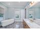 Bathroom featuring a soaking tub, vanity with marble countertop, and modern fixtures at 2415 Jasper Patterson Dr, Johns Island, SC 29455
