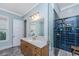 Bathroom featuring stylish vanity, a tiled walk-in shower with bronze fixtures at 2415 Jasper Patterson Dr, Johns Island, SC 29455