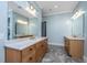 Bathroom featuring double vanities with marble counters and modern fixtures at 2415 Jasper Patterson Dr, Johns Island, SC 29455