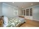 This bedroom features a decorative bookshelf, with natural light and hardwood floors at 2415 Jasper Patterson Dr, Johns Island, SC 29455