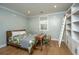 This bedroom features a decorative bookshelf, with natural light and hardwood floors at 2415 Jasper Patterson Dr, Johns Island, SC 29455