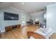 Bonus room featuring a wet bar, golf clubs, workspace, wood floors, and lots of natural light at 2415 Jasper Patterson Dr, Johns Island, SC 29455