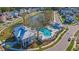 Aerial shot of a neighborhood pool with sun loungers, cabanas, and beautifully landscaped surroundings at 2415 Jasper Patterson Dr, Johns Island, SC 29455