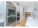 Kitchen with stainless steel appliances, custom cabinetry, and a marble countertop island with a sink and stylish faucet at 2415 Jasper Patterson Dr, Johns Island, SC 29455