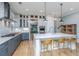 Open kitchen with a large island, stainless steel appliances, marble countertops, ample cabinetry, and barstool seating at 2415 Jasper Patterson Dr, Johns Island, SC 29455