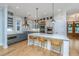 Modern kitchen with a large island, marble countertops, stainless steel appliances, and stylish barstool seating at 2415 Jasper Patterson Dr, Johns Island, SC 29455