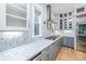 Modern kitchen featuring stainless steel appliances, marble backsplash, ample cabinetry, and a gas cooktop with hood at 2415 Jasper Patterson Dr, Johns Island, SC 29455