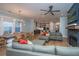 Spacious living room with hardwood floors, modern furniture, and a view into the kitchen and dining area at 2415 Jasper Patterson Dr, Johns Island, SC 29455