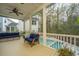 Spacious screened porch overlooking the backyard pool and lush foliage, perfect for outdoor living at 2415 Jasper Patterson Dr, Johns Island, SC 29455