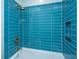 The bathroom features a blue tiled shower with gold fixtures and a storage nook at 2415 Jasper Patterson Dr, Johns Island, SC 29455