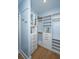 Walk-in closet with custom shelving and drawers; a well-organized storage solution at 2415 Jasper Patterson Dr, Johns Island, SC 29455