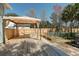 Backyard deck featuring an outdoor canopy, lush landscaping and room for entertaining and relaxing at 2612 Morning Dove Ln, Charleston, SC 29414